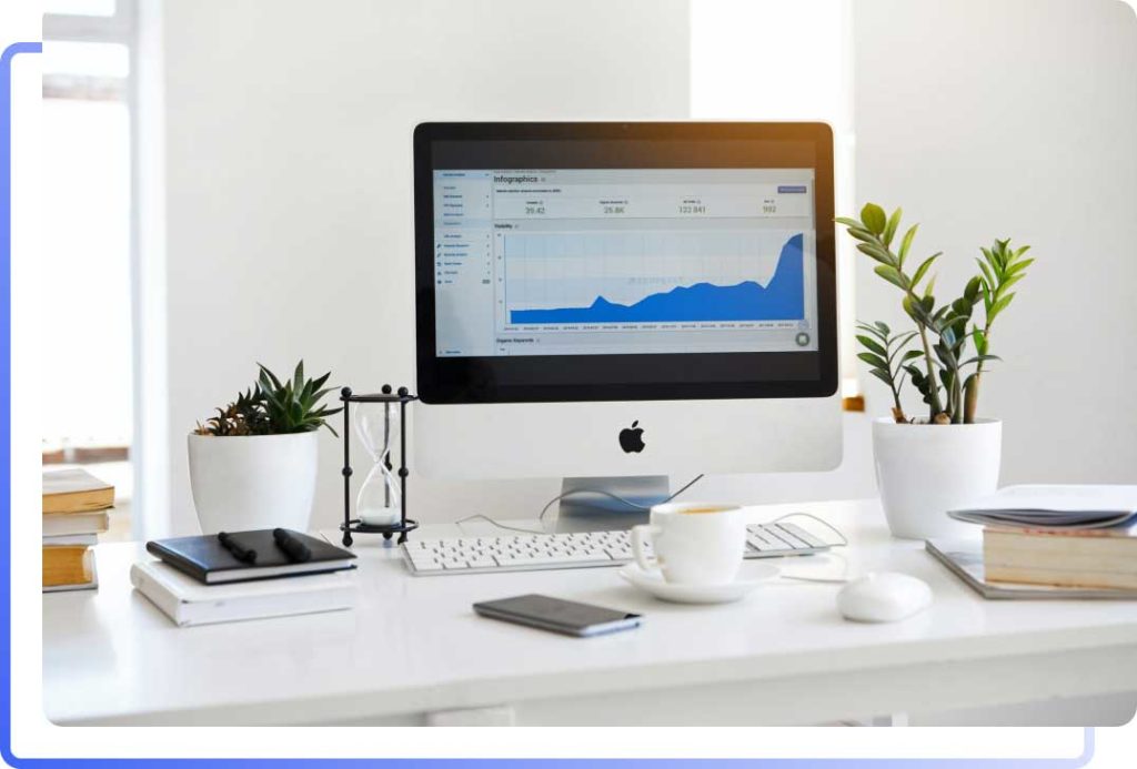 Desktop computer with analytics dashboard displaying digital growth