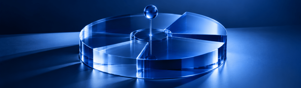 Glass pie chart divided into uneven segments with a pin at its center, representing marketing budget allocation.